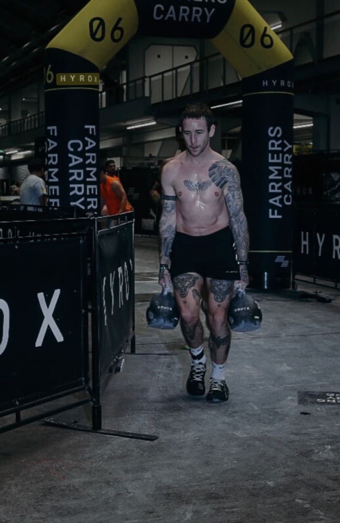 Hybrid365 athlete during a farmer carry
